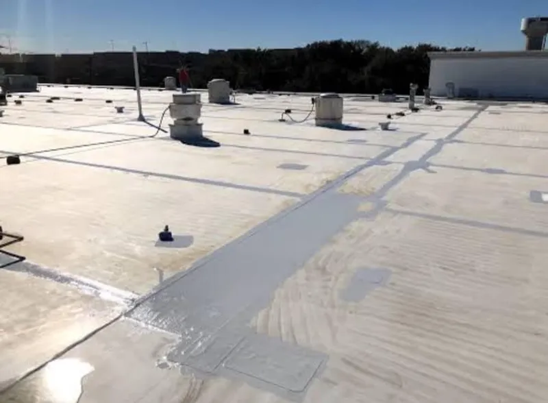 Overview of a clean low slope commercial roof structure after seasonal cleaning